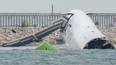 Cargo plane skids off runway into sea Hong Kong